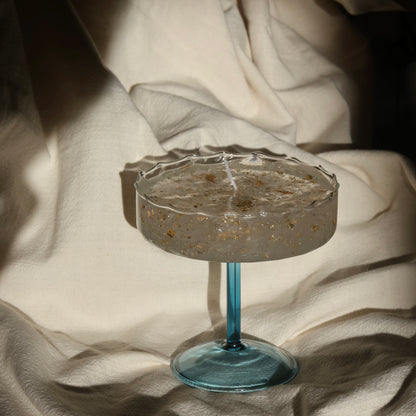Artistic gel candle in a vintage cocktail glass with golden flakes by Lily Glow Decor