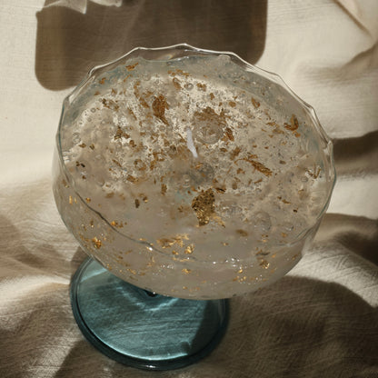 Artistic gel candle in a vintage cocktail glass with golden flakes by Lily Glow Decor