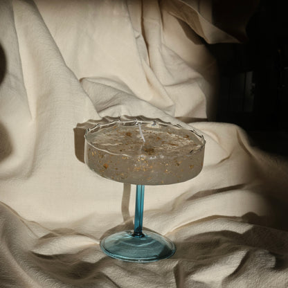 Artistic gel candle in a vintage cocktail glass with golden flakes by Lily Glow Decor