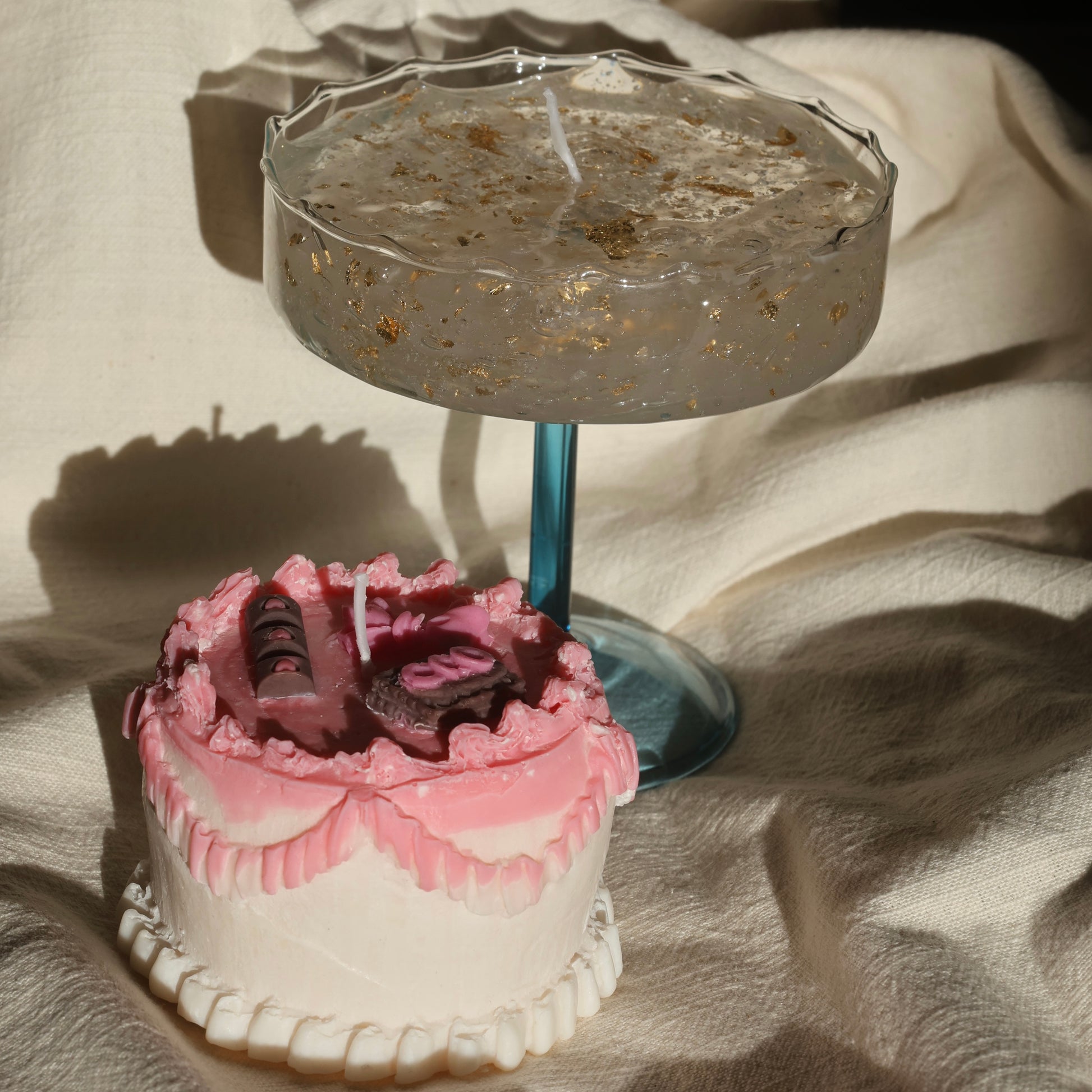 Artistic gel candle in a vintage cocktail glass with golden flakes by Lily Glow Decor