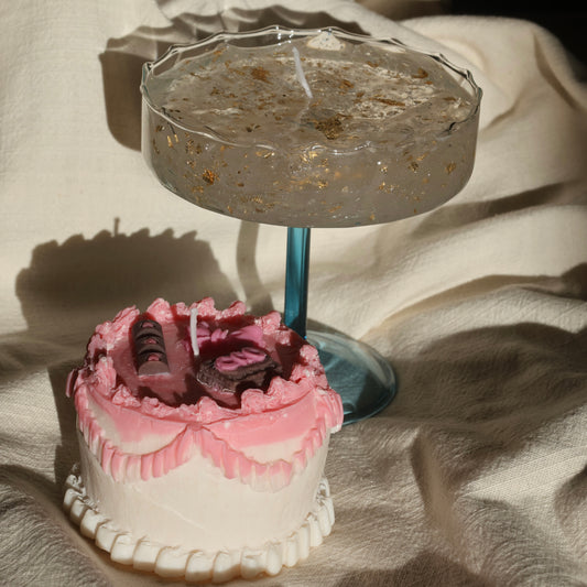 Artistic gel candle in a vintage cocktail glass with golden flakes by Lily Glow Home Decor