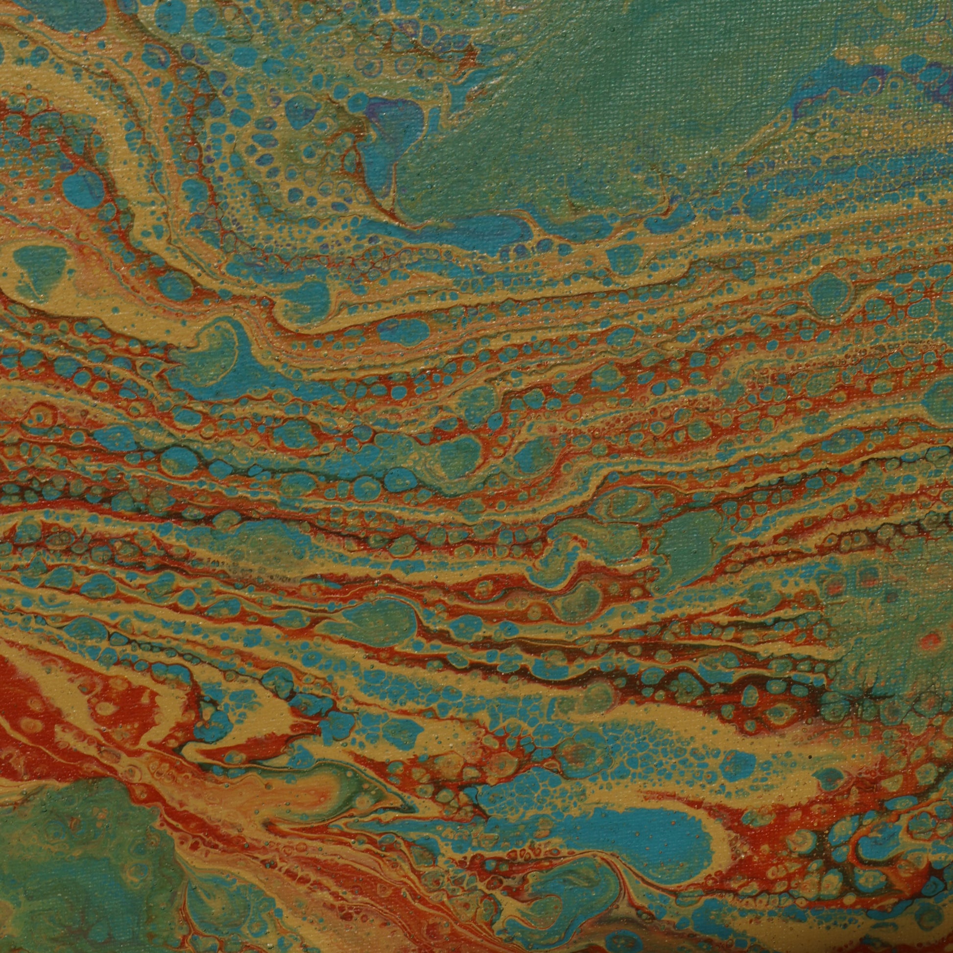 Abstract painting in 30x30 cm format with fluid patterns in blue, green, orange and beige tones, displayed against soft beige fabric by Lily Glow Decor