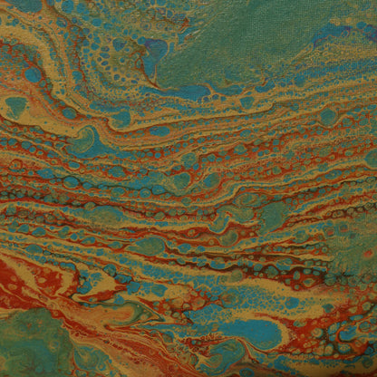 Abstract painting in 30x30 cm format with fluid patterns in blue, green, orange and beige tones, displayed against soft beige fabric by Lily Glow Decor