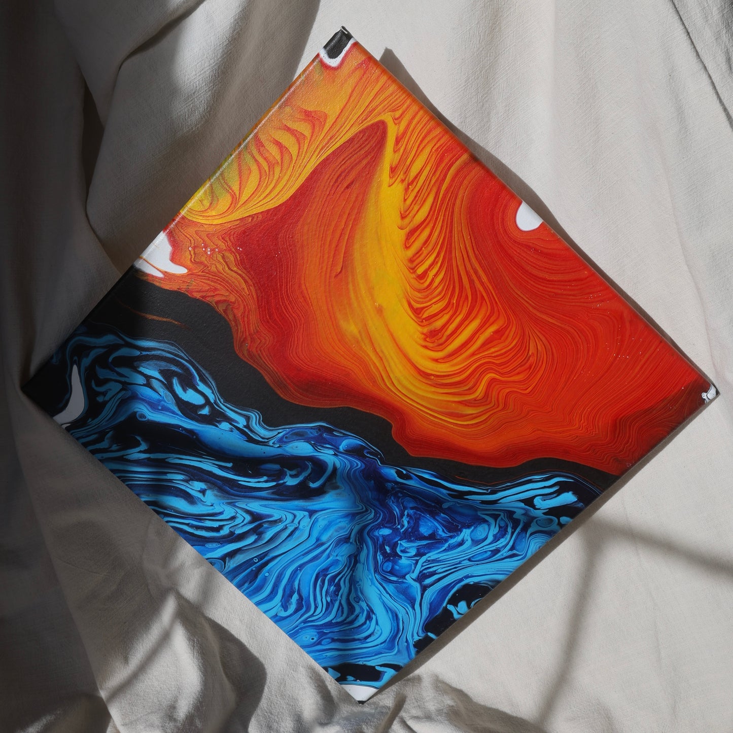 Abstract painting in red, yellow, and blue tones on canvas by Lily Glow Decor