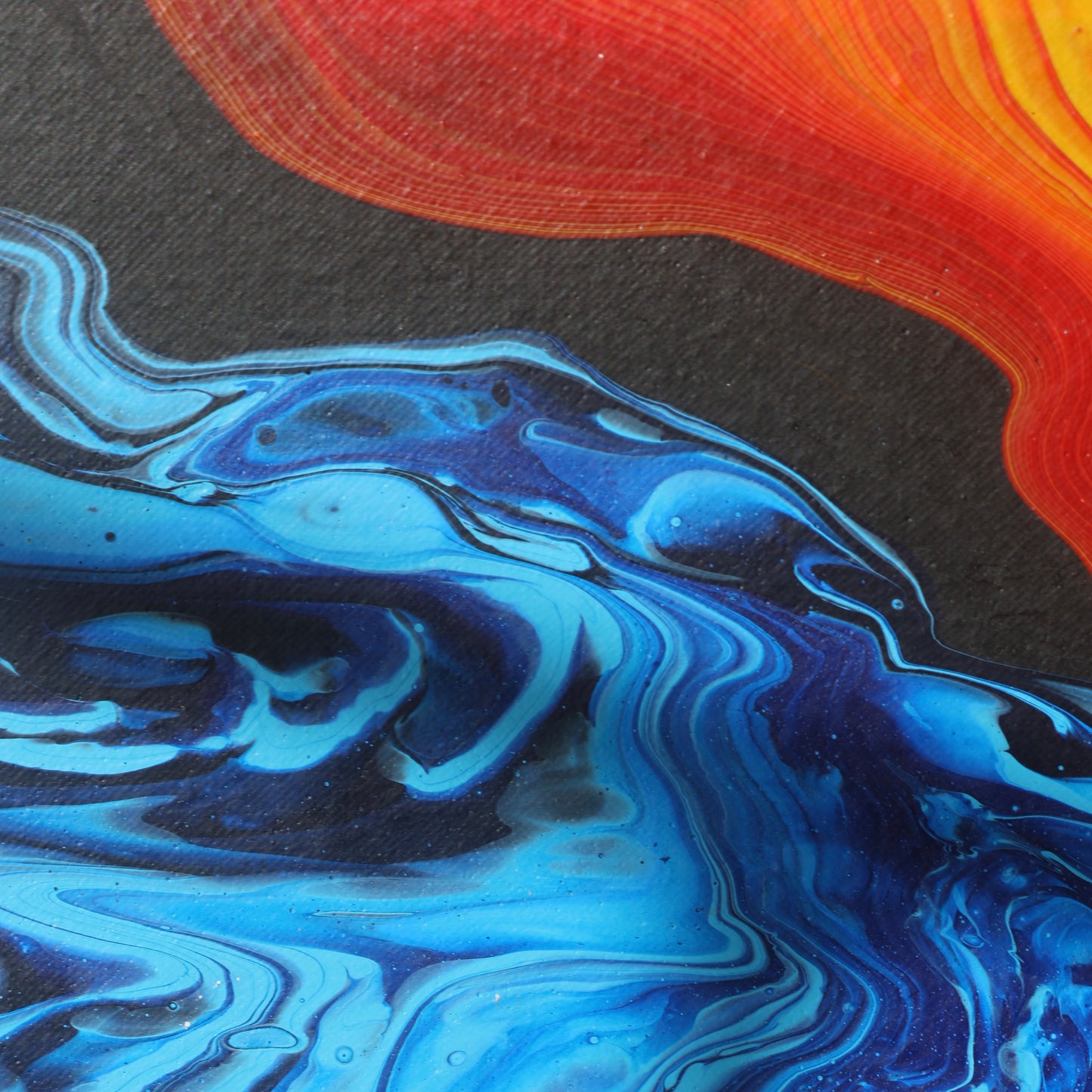 Abstract painting in red, yellow, and blue tones on canvas by Lily Glow Decor