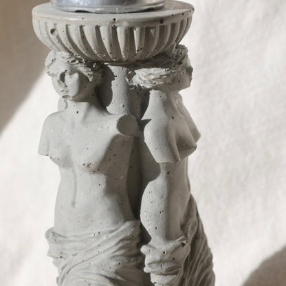 Close-up of sculptural details on Three Venuses candle holder by Lily Glow Decor