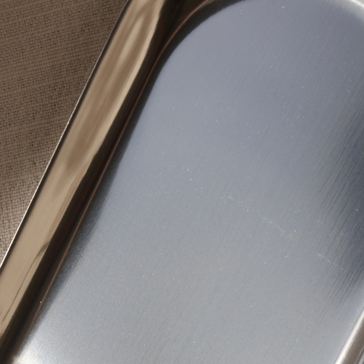 Close-up of silver candleholder by Lily Glow Decor surface texture