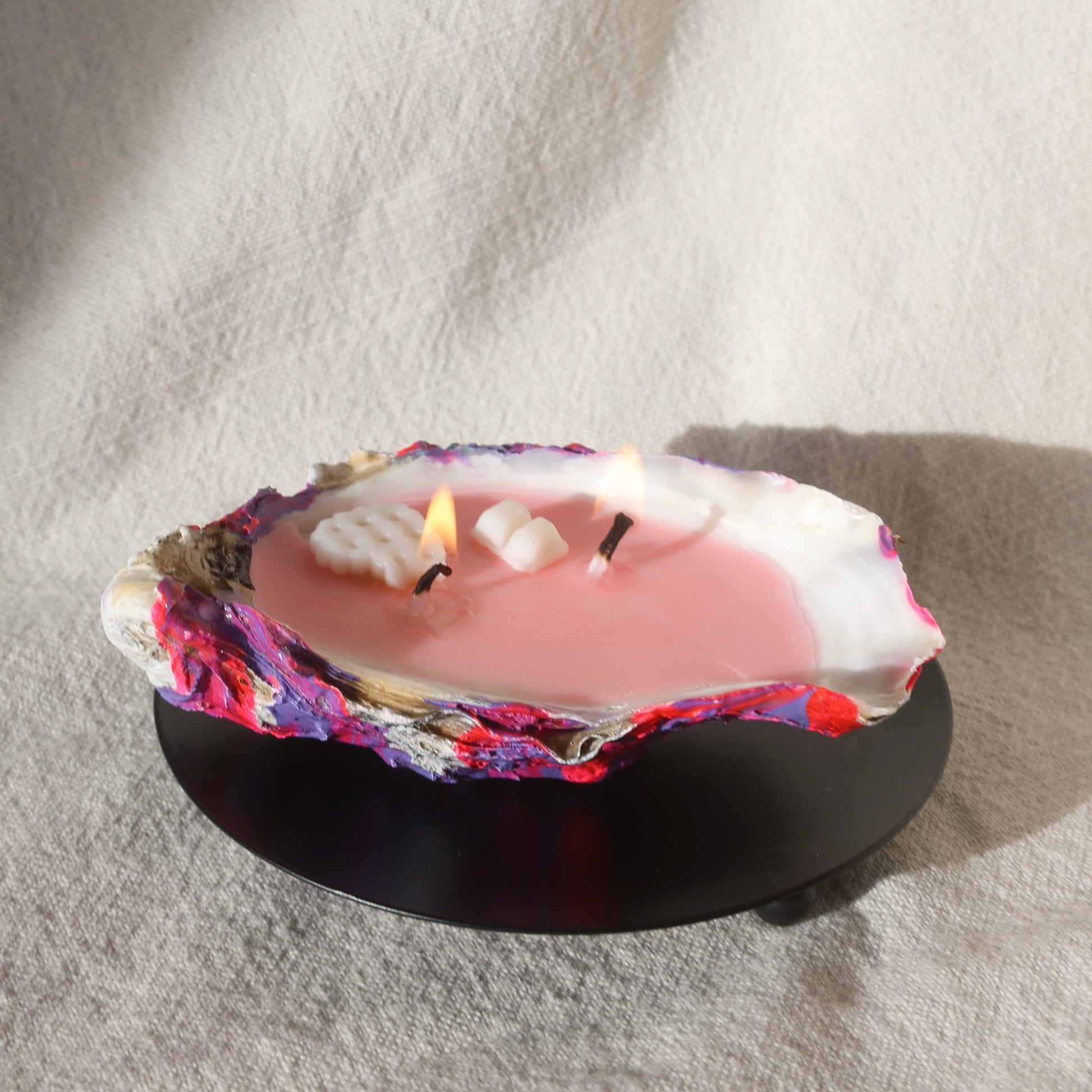 Round black candleholder with seashell candle by Lily Glow Decor