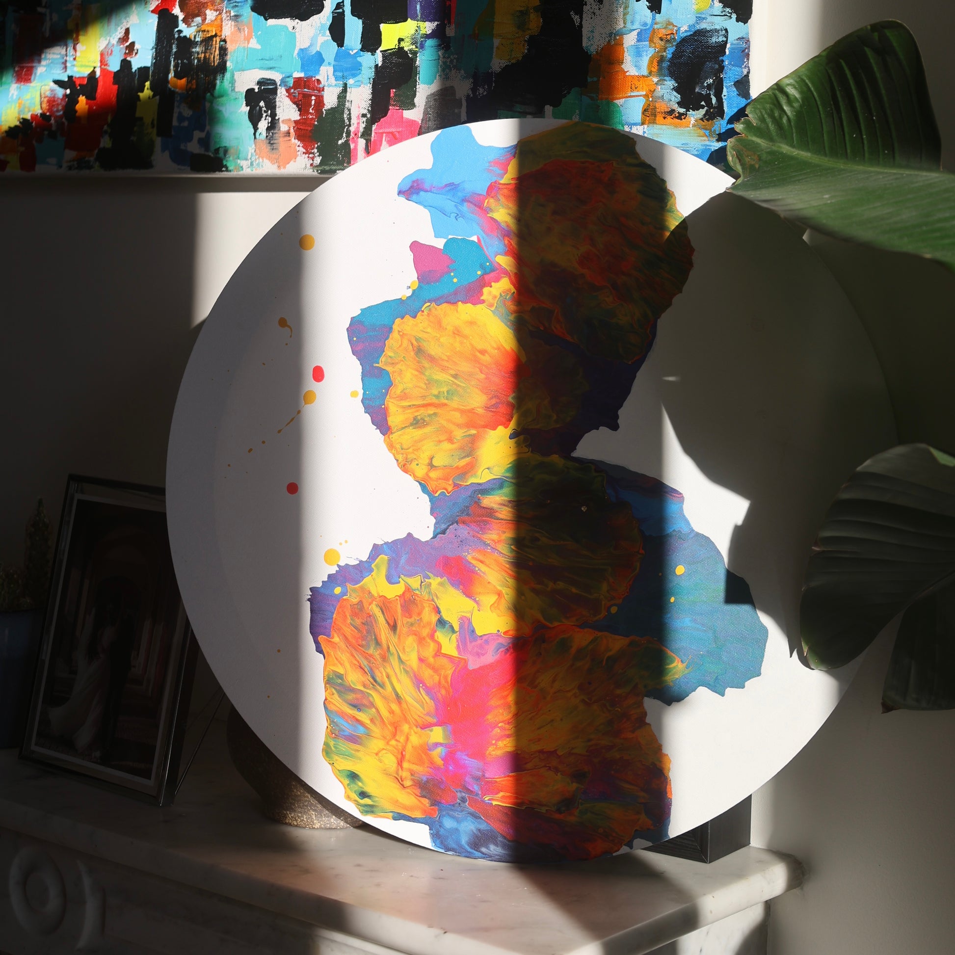 Round abstract painting with vivid red and yellow details | Lily Glow Home Decor