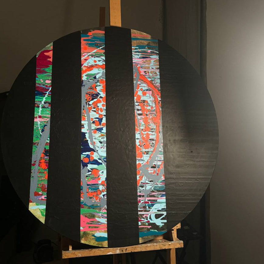 Round abstract painting with colorful splashes and black stripes by Lily Glow Decor