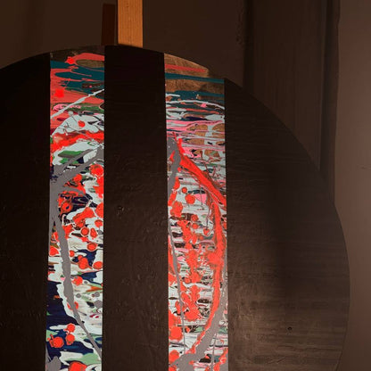 Round abstract painting with colorful splashes and black stripes by Lily Glow Decor