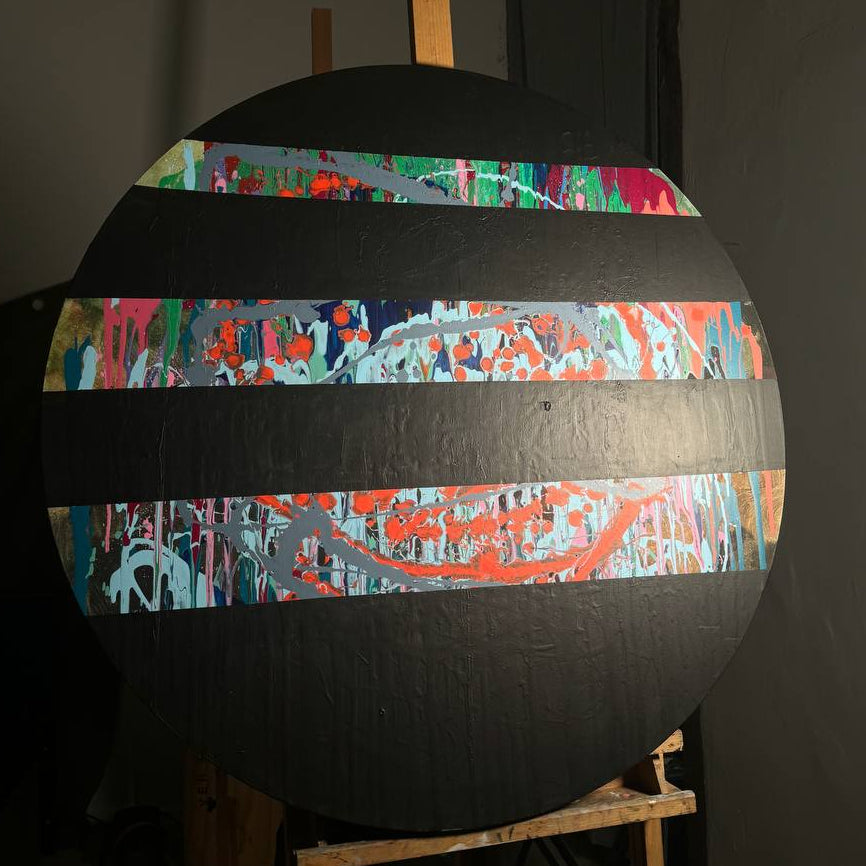 Round abstract painting with colorful splashes and black stripes by Lily Glow Decor