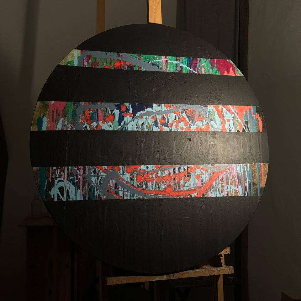Round abstract painting with colorful splashes and black stripes by Lily Glow Decor
