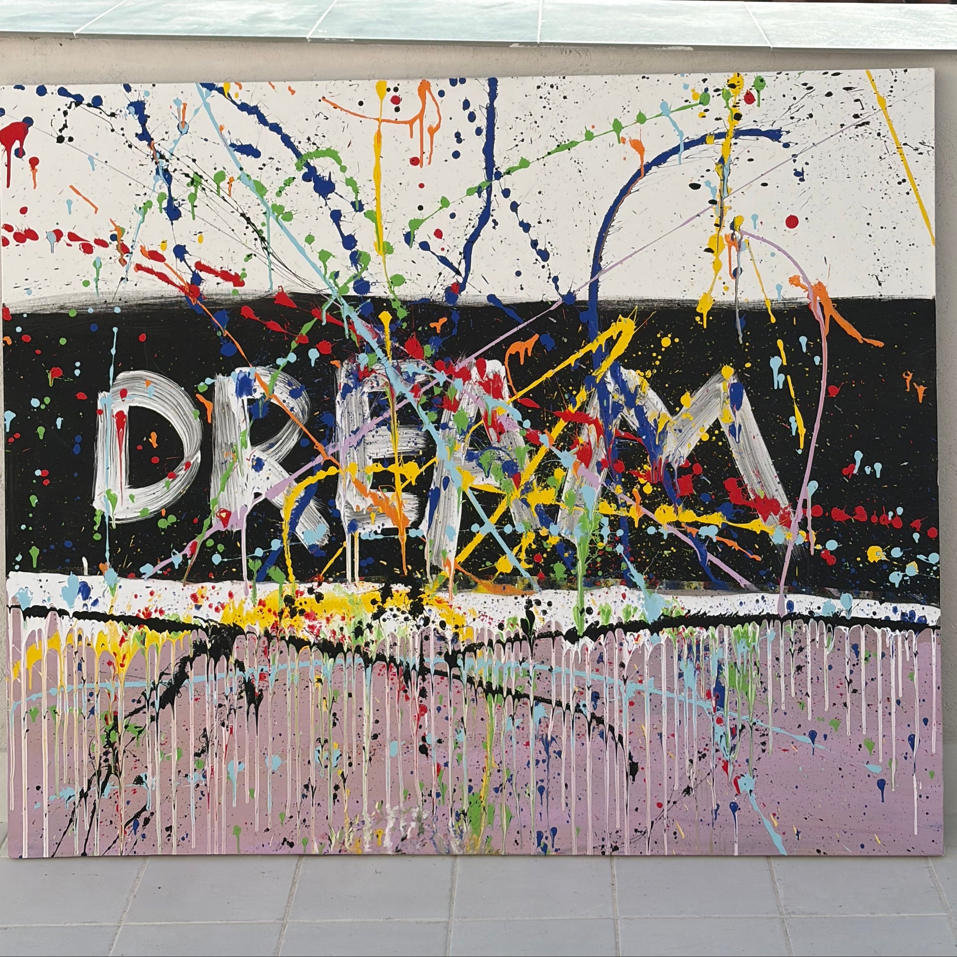 Large colorful abstract painting with word "DREAM" and bold splashes – Lily Glow Decor