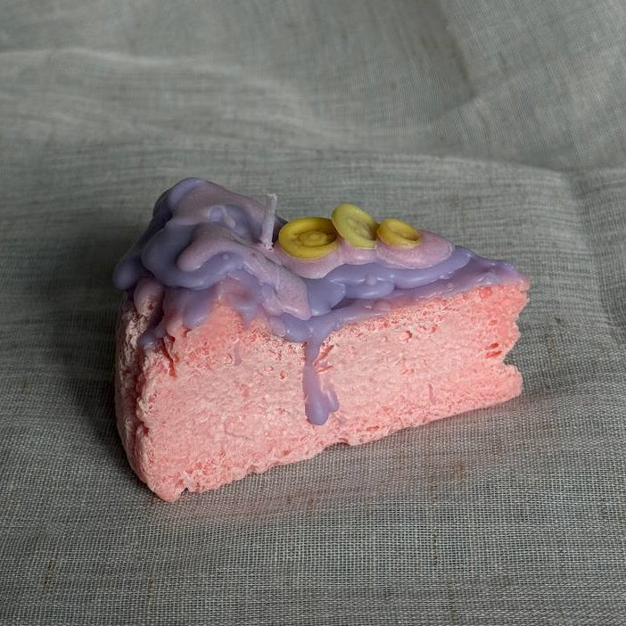 Whimsical cake slice candle in pink and purple colors by Lily Glow Home Decor