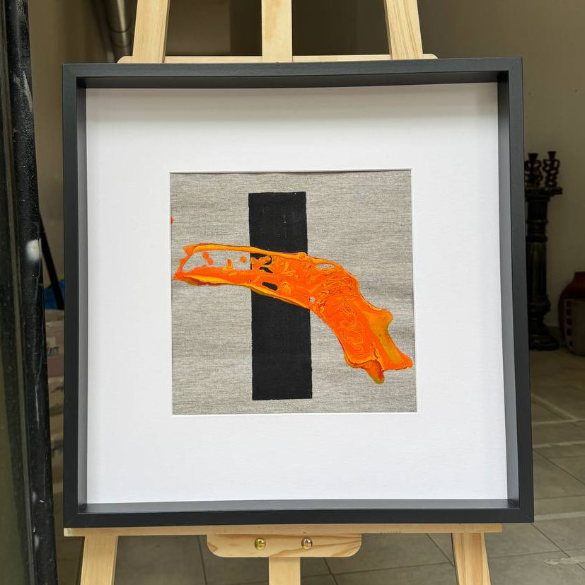 Framed abstract artwork with orange texture and black element Lily Glow Home Decor