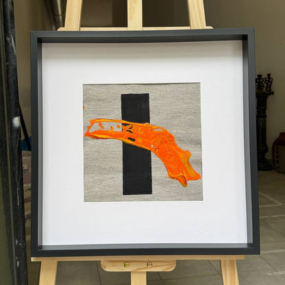 Framed abstract artwork with orange texture and black element Lily Glow Home Decor