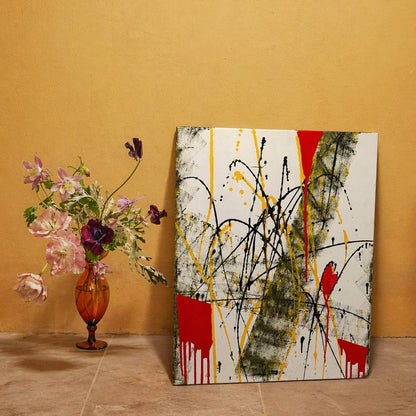 Abstract canvas with red, yellow and black splashes – Lily Glow Decor
