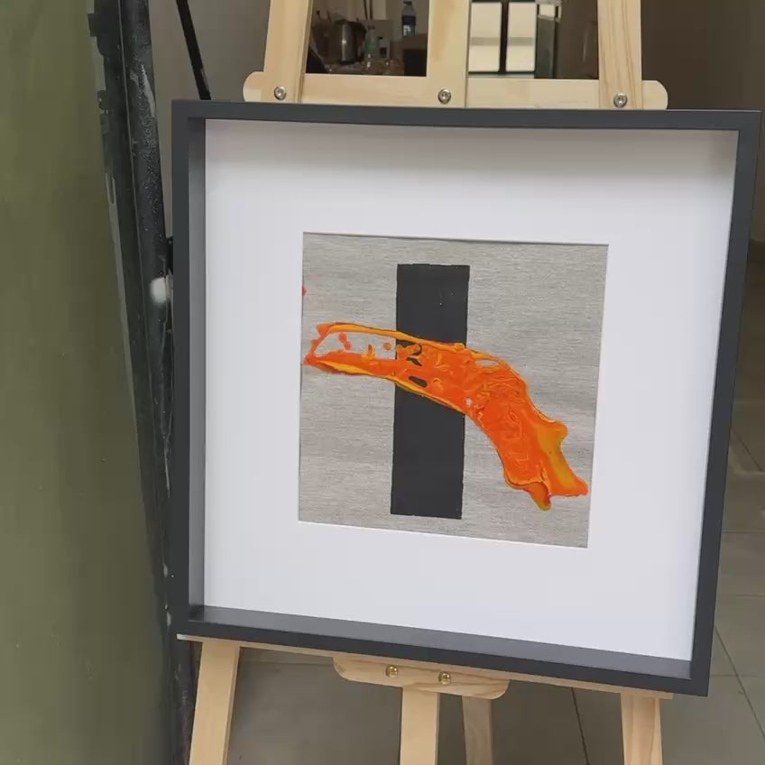 Framed abstract artwork with orange texture and black element Lily Glow Home Decor