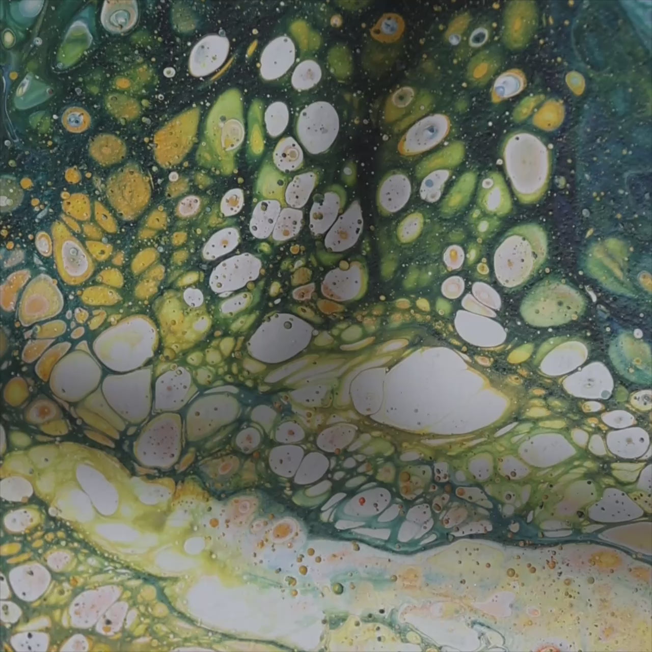 Close-up of a round canvas artwork with vibrant green and yellow abstract pattern on fabric background by Lily Glow Decor