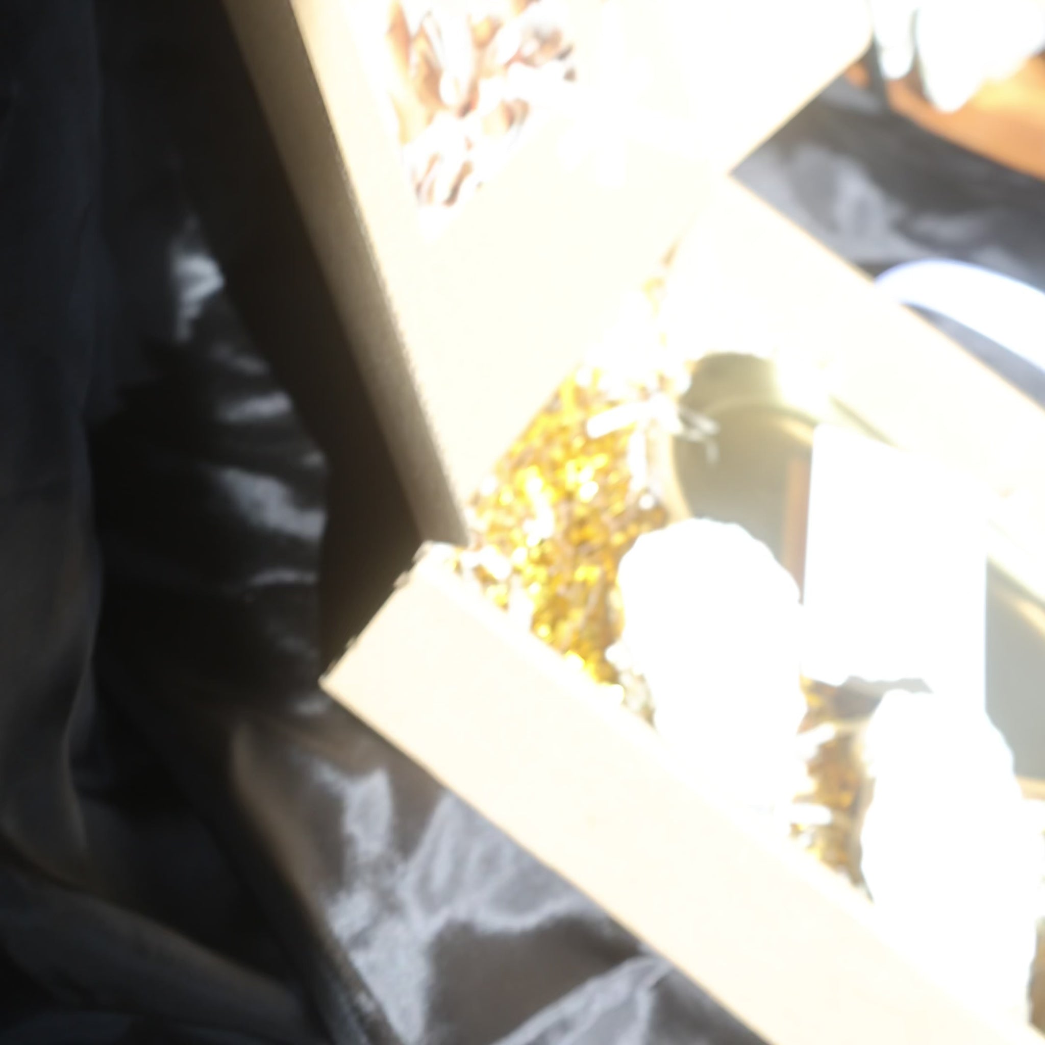 Two seashell candles with silver candleholder candleholder inside a gift box by Lily Glow Decor