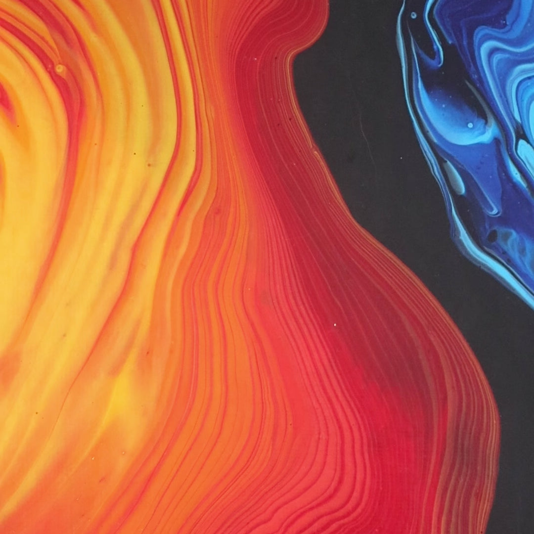 Abstract painting in red, yellow, and blue tones on canvas by Lily Glow Decor