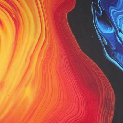 Abstract painting in red, yellow, and blue tones on canvas by Lily Glow Decor