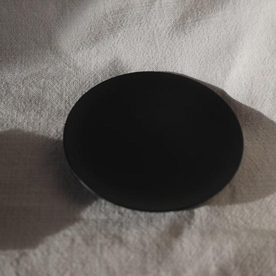 Round black candleholder with seashell candle by Lily Glow Decor