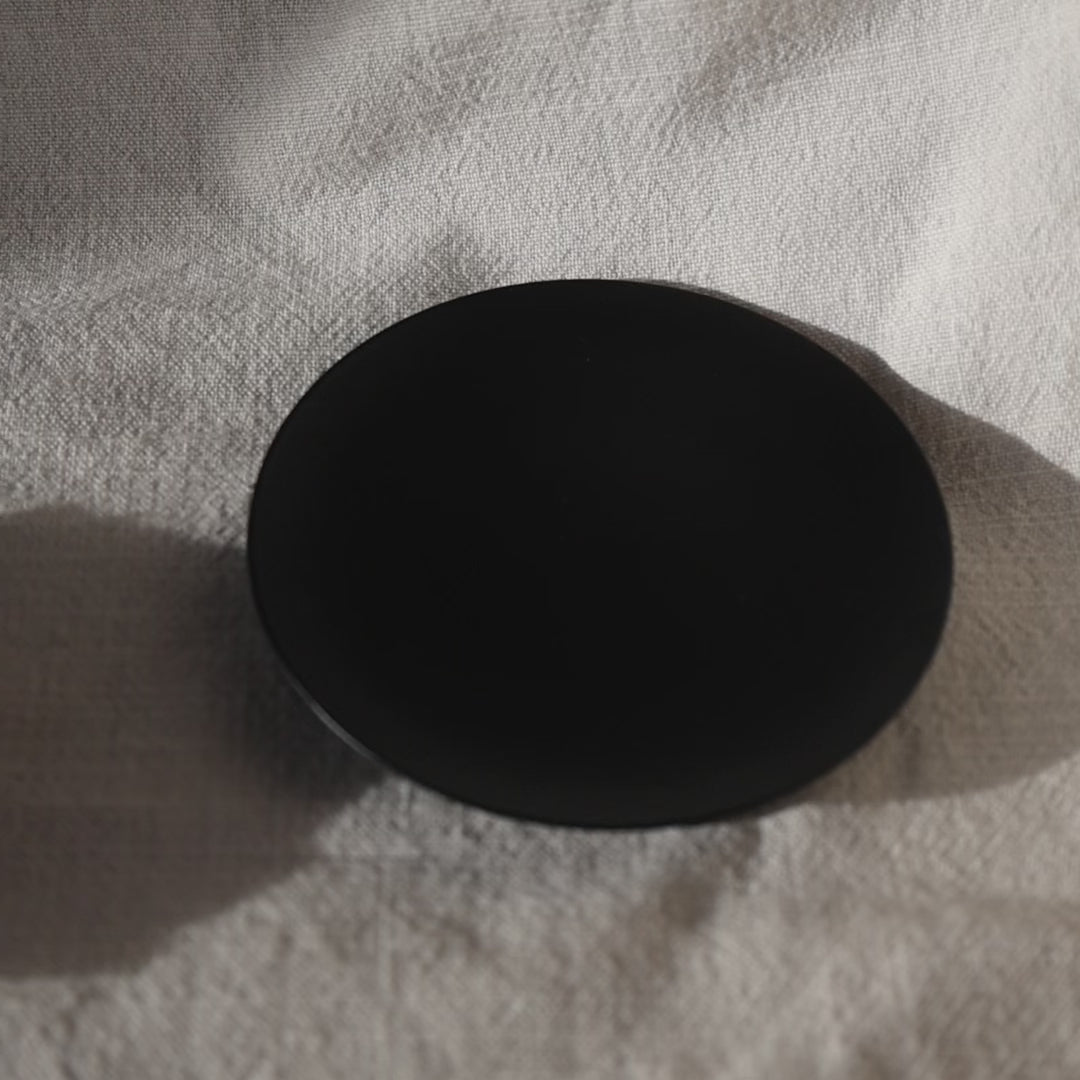 Round black candleholder with seashell candle by Lily Glow Decor